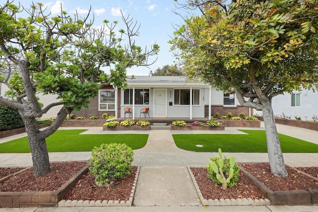 3833 Tomahawk Ln, San Diego, CA 92117 - view of front of home featuring a porch and a front lawn