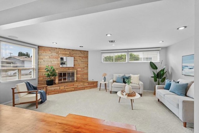 3833 Tomahawk Ln, San Diego, CA 92117 - living area featuring healthy amount of natural light, carpet, recessed lighting, and a stone fireplace