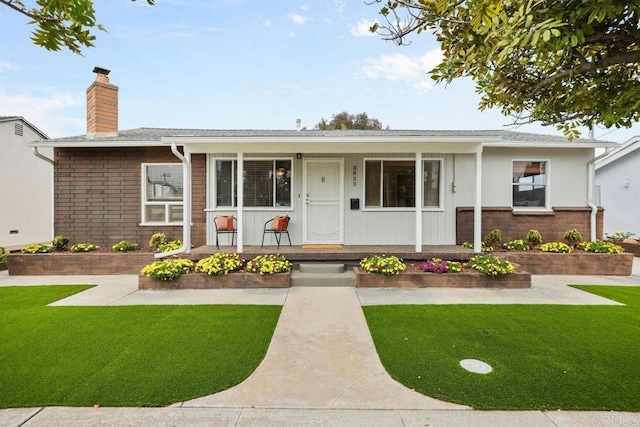 3833 Tomahawk Ln, San Diego, CA 92117 - ranch-style house featuring covered porch, a chimney, a front yard, and roof with shingles
