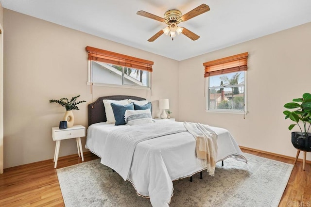 3833 Tomahawk Ln, San Diego, CA 92117 - bedroom with light wood finished floors and a ceiling fan