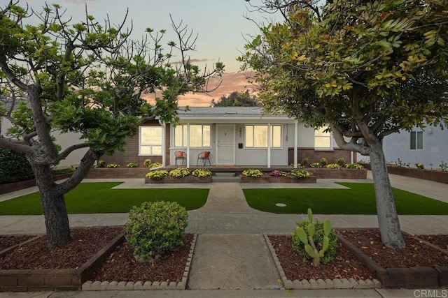3833 Tomahawk Ln, San Diego, CA 92117 - view of front of home featuring a lawn and a porch