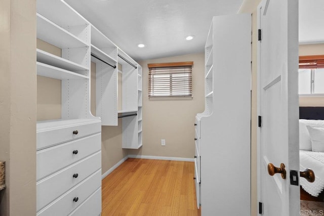 3833 Tomahawk Ln, San Diego, CA 92117 - walk in closet featuring light wood finished floors