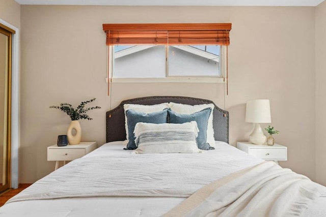 3833 Tomahawk Ln, San Diego, CA 92117 - bedroom with multiple windows and wood finished floors