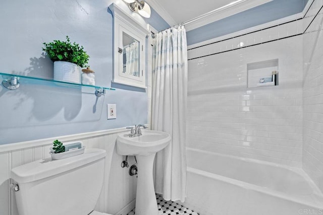 3833 Tomahawk Ln, San Diego, CA 92117 - full bathroom featuring shower / bath combo with shower curtain, a wainscoted wall, and crown molding