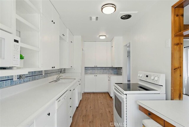 185 N Rodecker Dr, Azusa, CA 91702 - kitchen featuring white appliances, open shelves, white cabinets, and light wood-style floors