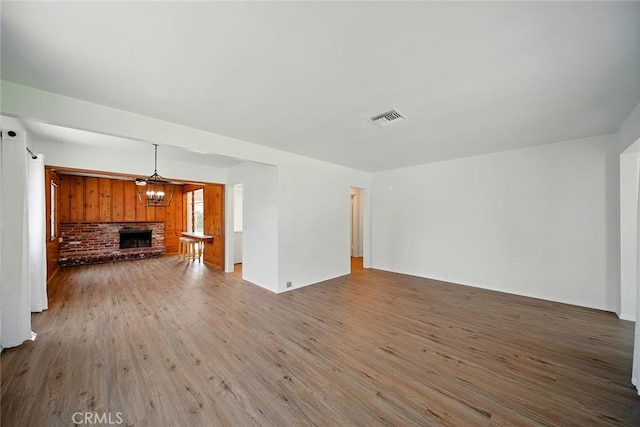 185 N Rodecker Dr, Azusa, CA 91702 - unfurnished living room with wood finished floors and a fireplace