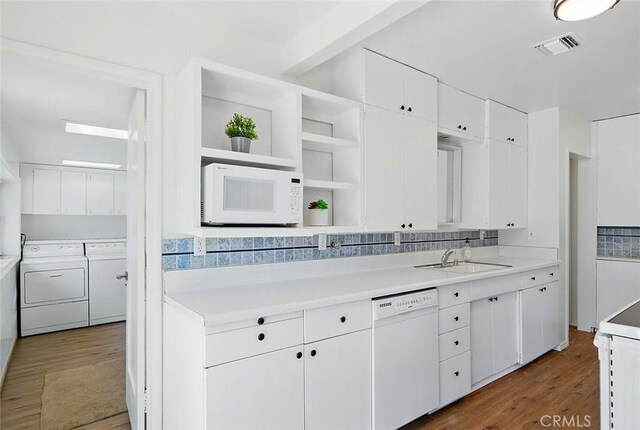185 N Rodecker Dr, Azusa, CA 91702 - kitchen with white appliances, washer and dryer, wood finished floors, and white cabinetry
