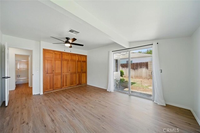 185 N Rodecker Dr, Azusa, CA 91702 - unfurnished bedroom with access to outside, light wood finished floors, beamed ceiling, a closet, and ceiling fan
