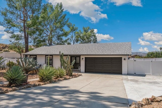 27111 Crews Hill Dr, Menifee, CA 92586 - ranch-style home with an attached garage, driveway, a gate, and roof with shingles