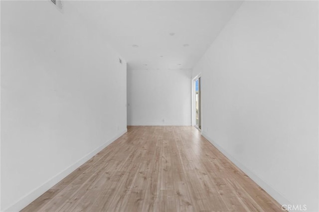 7419 N Mia Ln, Van Nuys, CA 91405 - empty room with light wood-style flooring and baseboards