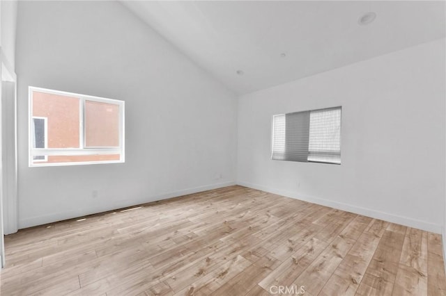 7419 N Mia Ln, Van Nuys, CA 91405 - empty room featuring wood finished floors and high vaulted ceiling