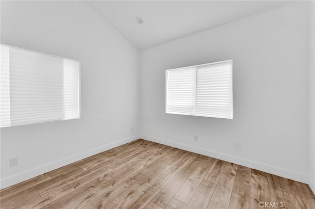 7419 N Mia Ln, Van Nuys, CA 91405 - empty room with vaulted ceiling and wood finished floors