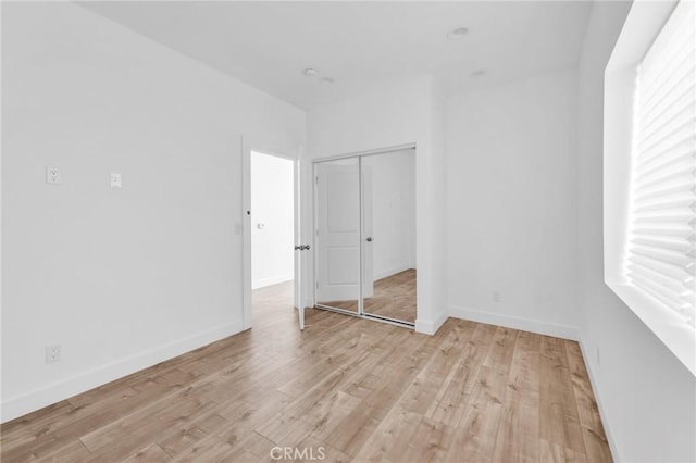 7419 N Mia Ln, Van Nuys, CA 91405 - unfurnished bedroom with light wood-type flooring and a closet