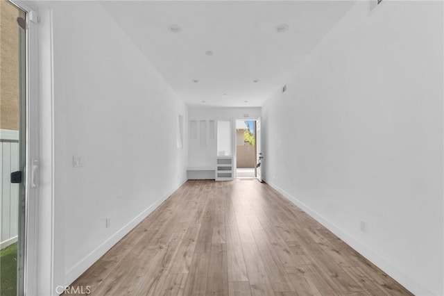 7419 N Mia Ln, Van Nuys, CA 91405 - unfurnished room with light wood-style flooring and baseboards