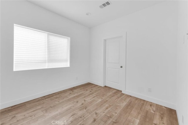 7419 N Mia Ln, Van Nuys, CA 91405 - spare room with light wood-style flooring and baseboards