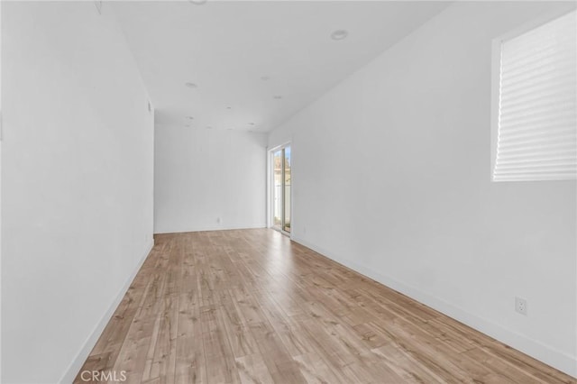 7419 N Mia Ln, Van Nuys, CA 91405 - spare room with light wood-style flooring and baseboards