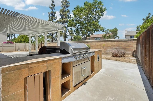 12910 Jersey St, Eastvale, CA 92880 - fenced backyard featuring a pergola, a patio, and an outdoor kitchen