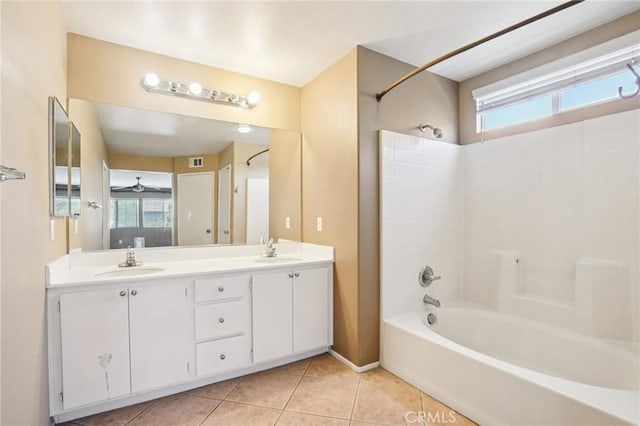 12910 Jersey St, Eastvale, CA 92880 - bathroom featuring tile patterned floors, bathtub / shower combination, double vanity, and ceiling fan
