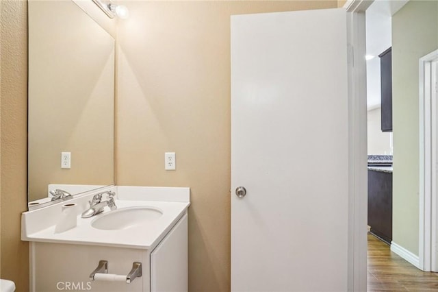 12910 Jersey St, Eastvale, CA 92880 - bathroom with vanity and wood finished floors