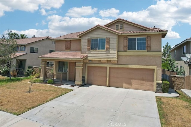 12910 Jersey St, Eastvale, CA 92880 - view of front of house with an attached garage, a tile roof, concrete driveway, covered porch, and stucco siding