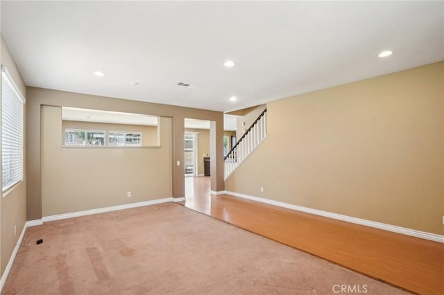 12910 Jersey St, Eastvale, CA 92880 - foyer with plenty of natural light, recessed lighting, light carpet, and stairway