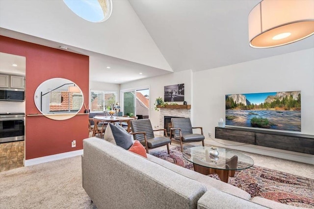 17915 Caminito Pinero Unit 264, San Diego, CA 92128 - living area with light carpet, a fireplace, high vaulted ceiling, and recessed lighting