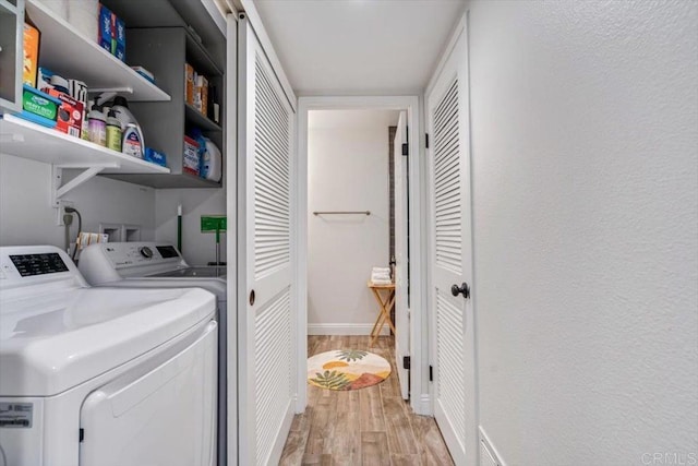17915 Caminito Pinero Unit 264, San Diego, CA 92128 - washroom with independent washer and dryer and light wood finished floors