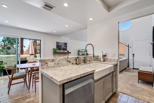 17915 Caminito Pinero Unit 264, San Diego, CA 92128 - kitchen with dishwasher, light wood-style floors, recessed lighting, gray cabinetry, and light stone counters