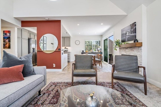 17915 Caminito Pinero Unit 264, San Diego, CA 92128 - living room with recessed lighting, a fireplace, and light carpet