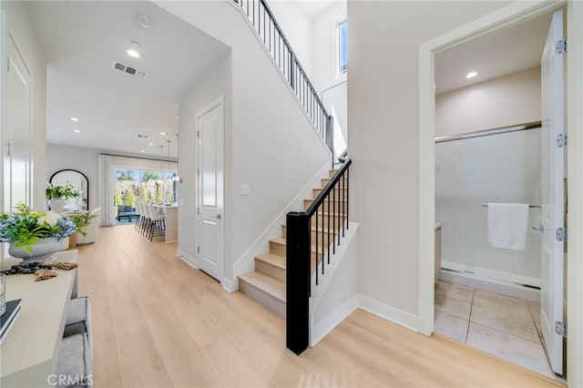 211 Wild Flower, Lake Forest, CA 92630 - stairway with wood finished floors and recessed lighting
