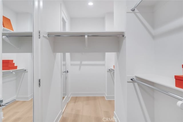 211 Wild Flower, Lake Forest, CA 92630 - walk in closet with light wood-style floors