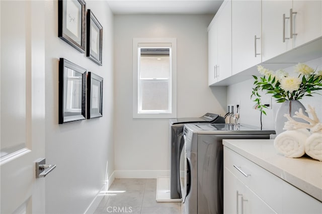 211 Wild Flower, Lake Forest, CA 92630 - washroom with separate washer and dryer, cabinet space, and light tile patterned floors