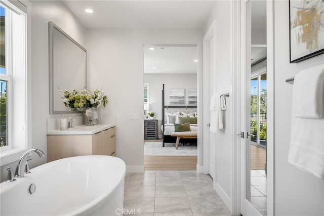 211 Wild Flower, Lake Forest, CA 92630 - full bath with a freestanding tub, vanity, recessed lighting, and ensuite bathroom
