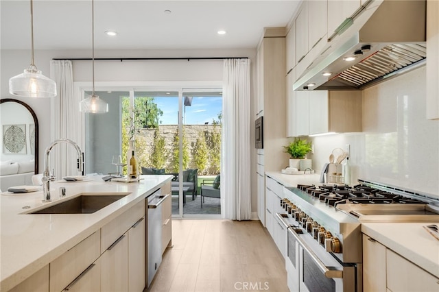 211 Wild Flower, Lake Forest, CA 92630 - kitchen with stainless steel appliances, under cabinet range hood, light countertops, and recessed lighting