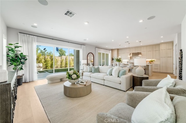 211 Wild Flower, Lake Forest, CA 92630 - living area featuring recessed lighting and light wood-type flooring