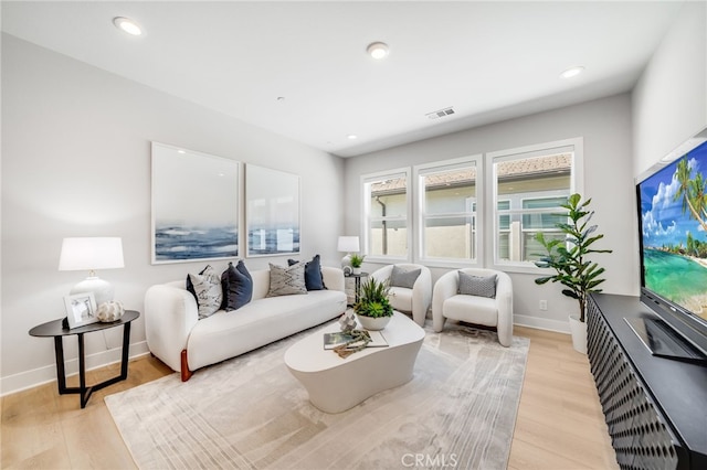 211 Wild Flower, Lake Forest, CA 92630 - living area with light wood-style flooring and recessed lighting