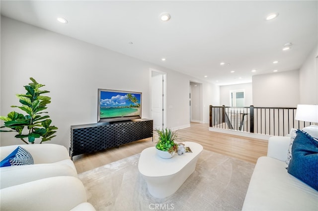 211 Wild Flower, Lake Forest, CA 92630 - living area with light wood-style floors and recessed lighting