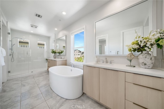 211 Wild Flower, Lake Forest, CA 92630 - full bathroom with a shower stall, two vanities, a freestanding bath, and recessed lighting