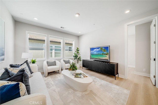 211 Wild Flower, Lake Forest, CA 92630 - living room with light wood-style floors and recessed lighting