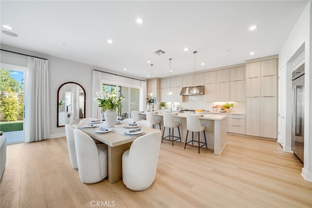 211 Wild Flower, Lake Forest, CA 92630 - dining space with light wood-style flooring and recessed lighting