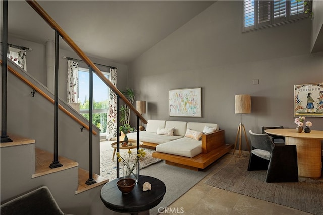 837 N W Knoll Dr Unit 307, West Hollywood, CA 90069 - living room with high vaulted ceiling, plenty of natural light, and stairway