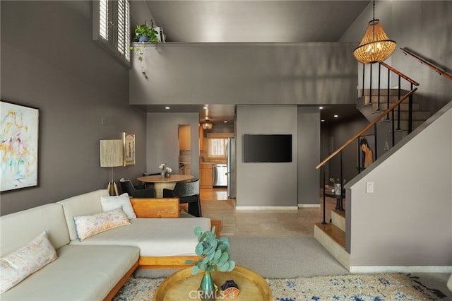 837 N W Knoll Dr Unit 307, West Hollywood, CA 90069 - living room with stairs and a high ceiling
