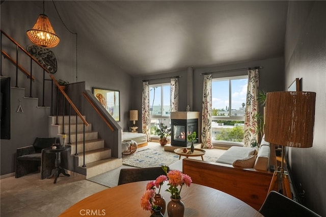 837 N W Knoll Dr Unit 307, West Hollywood, CA 90069 - living area featuring stairs, a chandelier, lofted ceiling, and a multi sided fireplace