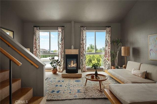 837 N W Knoll Dr Unit 307, West Hollywood, CA 90069 - living area with healthy amount of natural light, stairway, and a glass covered fireplace