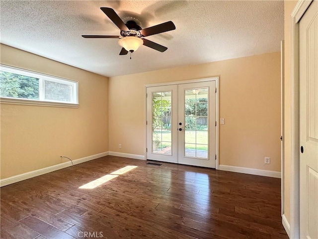 2817 San Verbena Way, Chico, CA 95973 - unfurnished room with french doors, plenty of natural light, dark wood-style flooring, and a textured ceiling