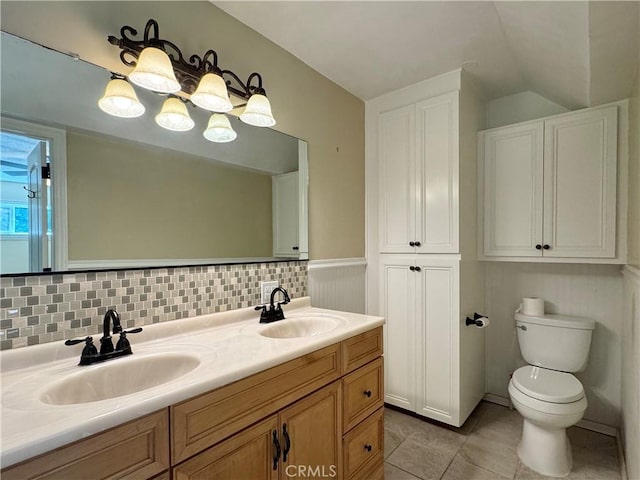2817 San Verbena Way, Chico, CA 95973 - bathroom featuring double vanity, tile patterned floors, lofted ceiling, and backsplash