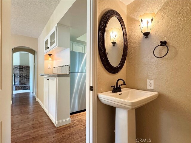 2817 San Verbena Way, Chico, CA 95973 - bathroom with a textured wall, wood finished floors, and a textured ceiling