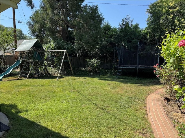 2817 San Verbena Way, Chico, CA 95973 - fenced backyard featuring a trampoline and a playground