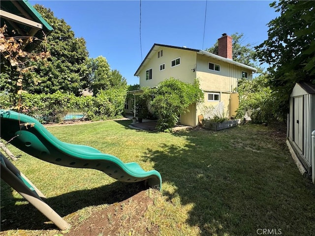 2817 San Verbena Way, Chico, CA 95973 - view of yard featuring a playground and a storage unit