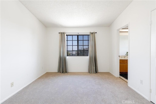 854 N Harbor Blvd, La Habra, CA 90631 - spare room featuring light carpet and a textured ceiling
